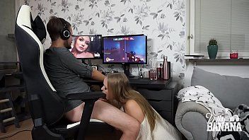 He plays on the PC and the bitch gives him a blowjob
